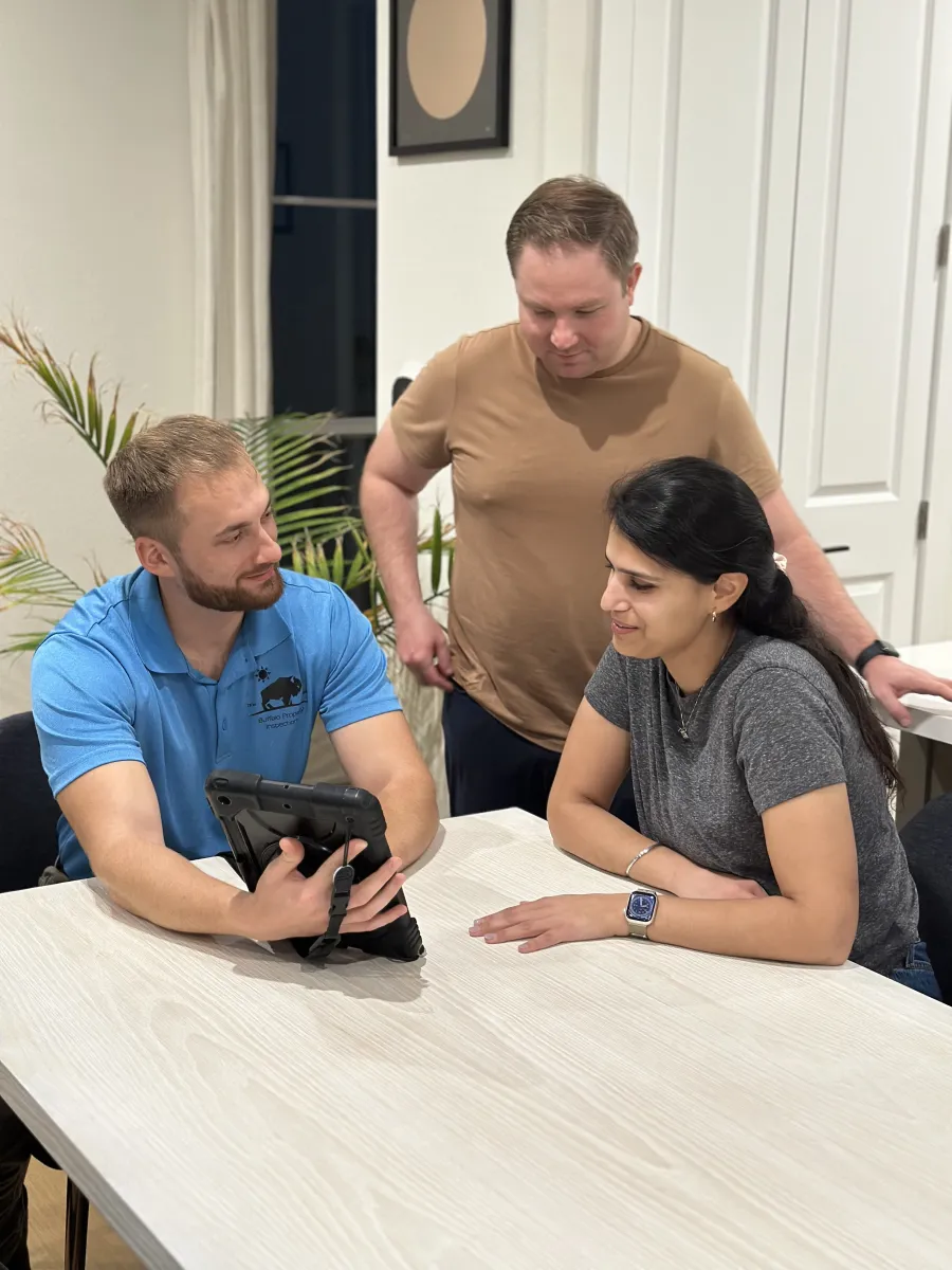 Home inspector reviewing the inspection report with DFW buyers