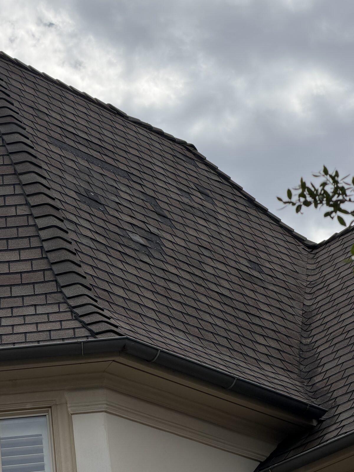 Lifted roof shingles found during a Dallas-Fort Worth roof inspection