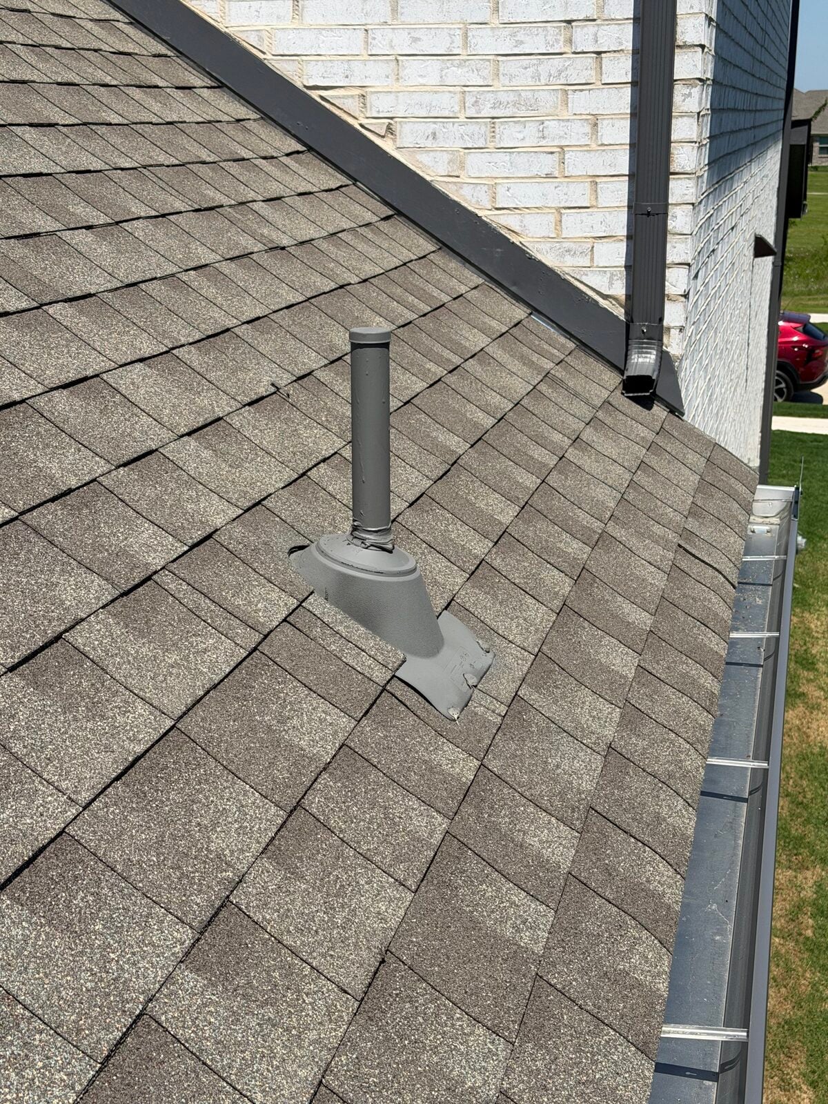 Roof plumbing vent boot and flashing checked during a Dallas-Fort Worth roof inspection