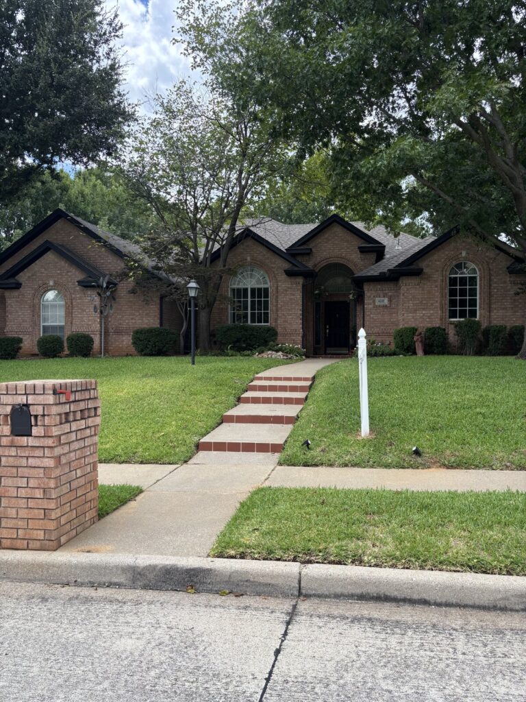 Front elevation and walkway of a Dallas-Fort Worth brick home during a home inspection - Buffalo Property Inspections